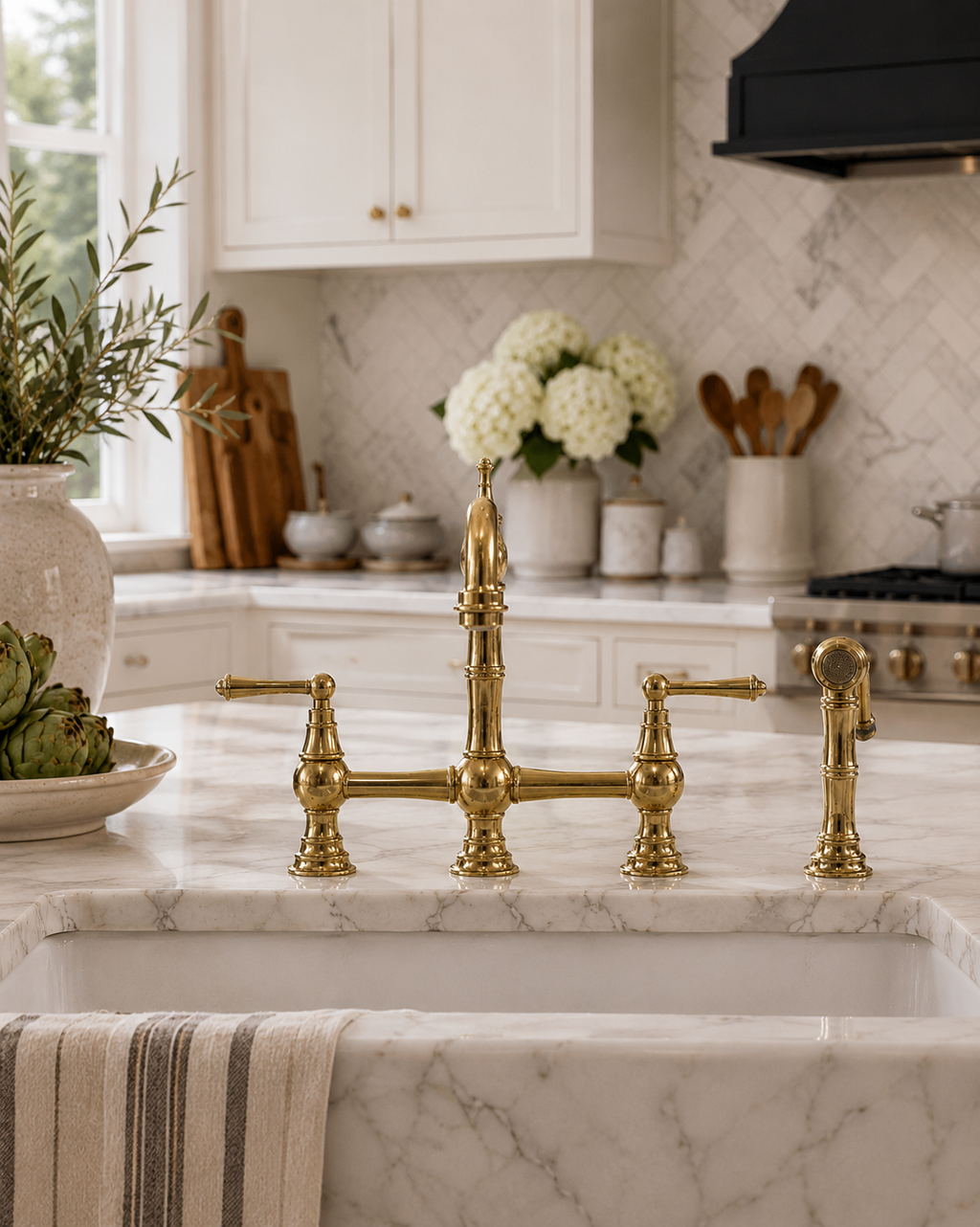 Kitchen with marble countertop and gold faucet
