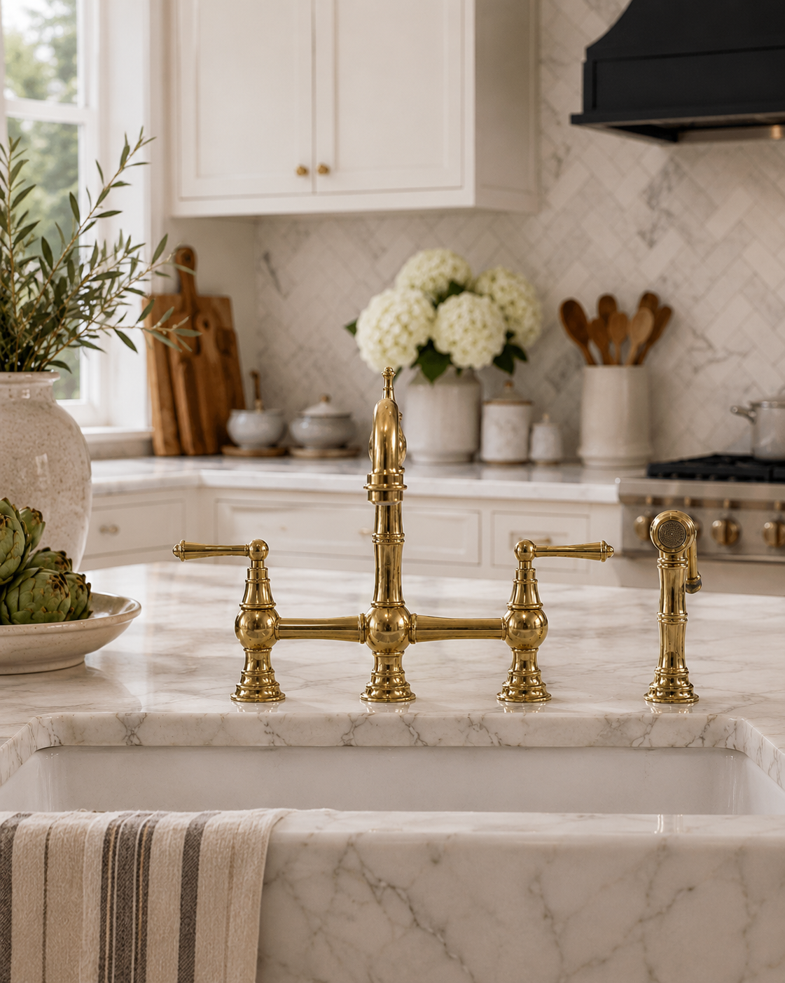 Kitchen with marble countertop and gold faucet