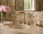 Bathroom sink with gold faucet and floral wallpaper