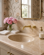 Minimal brass wall faucet with marble vanity