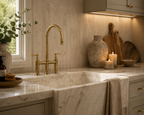 Kitchen with marble sink, gold faucet, and decorative elements.